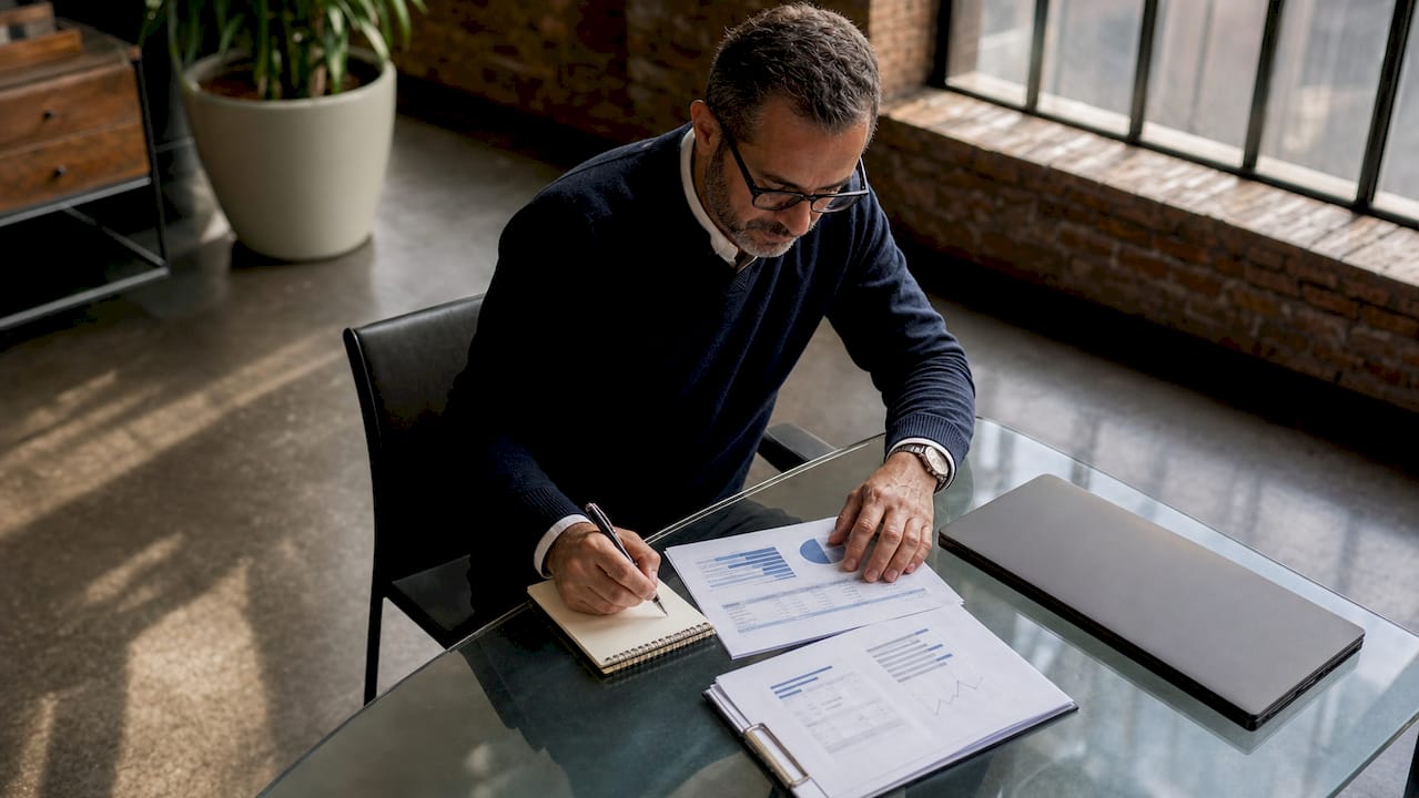 Business owner reviewing revenue data and tasks