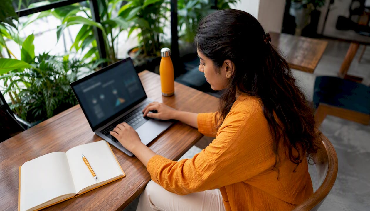 Woman viewing crypto portfolio dashboard at home