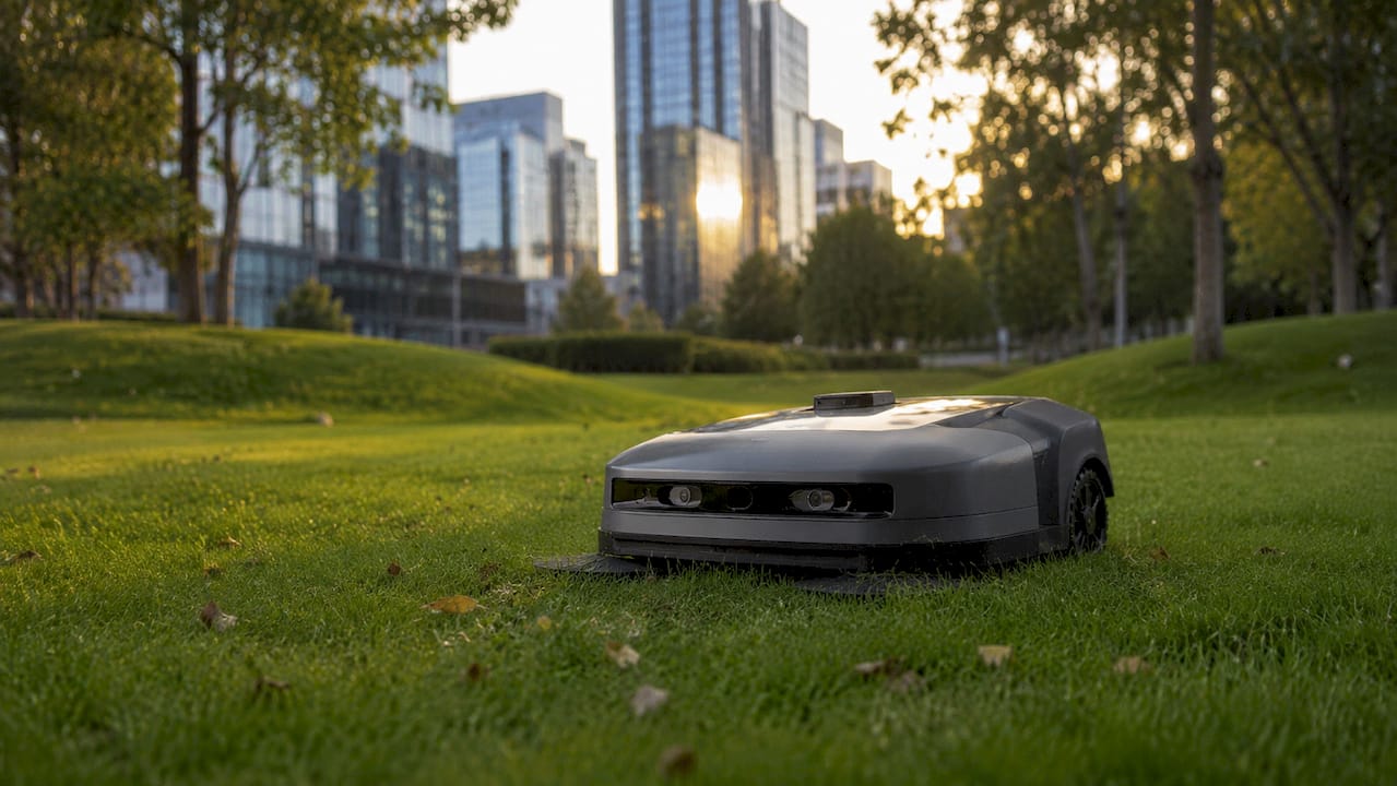 Autonomous lawn mowing robot on grass
