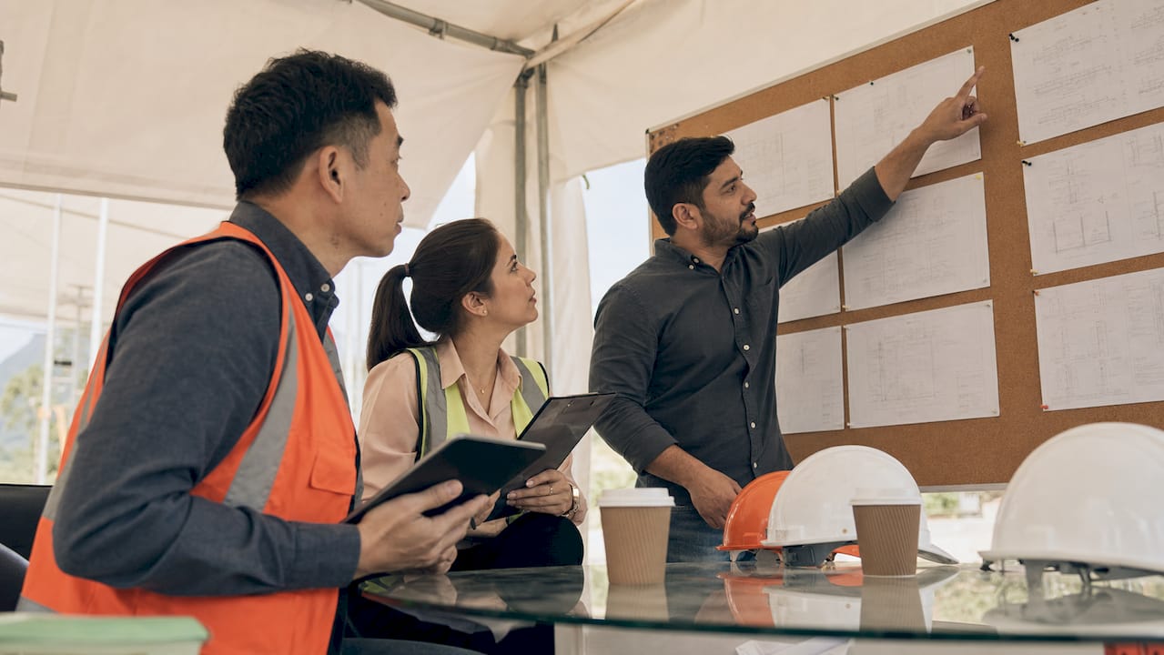 Construction team reviewing RFI documents in meeting room