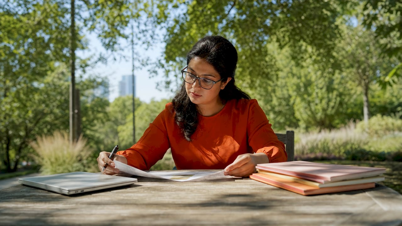 Woman reviewing software RFP document in office