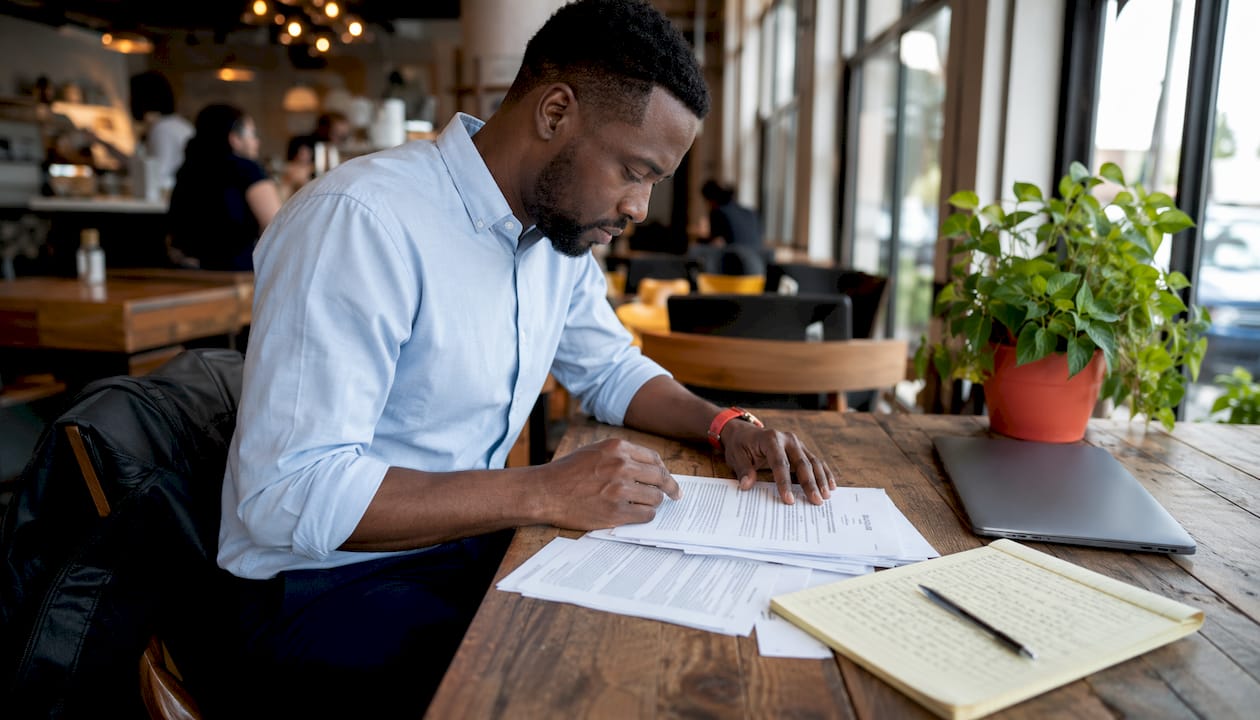 Man reviewing government video contract paperwork