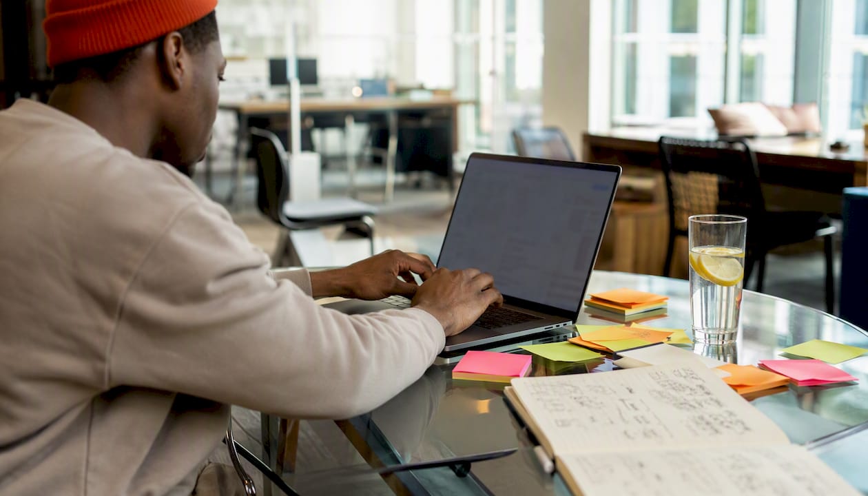 Hands typing on laptop during software pilot