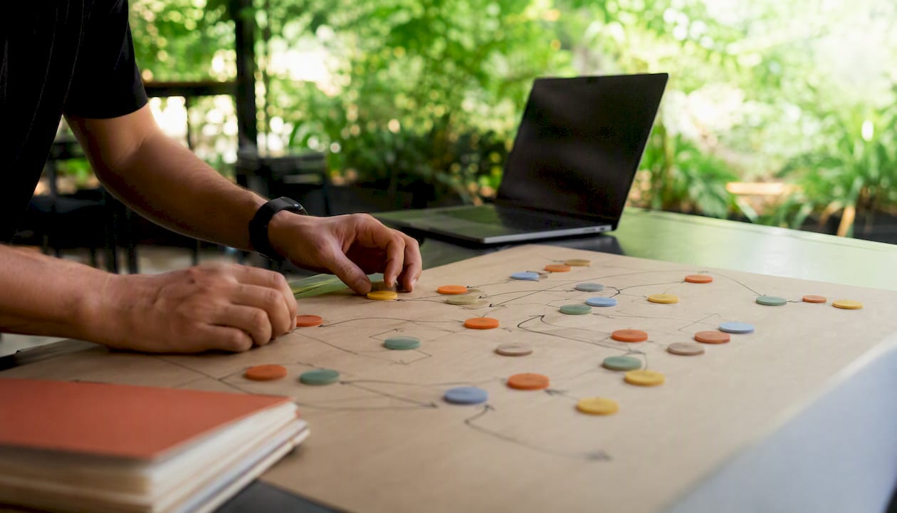 Hands placing tokens representing edge cases