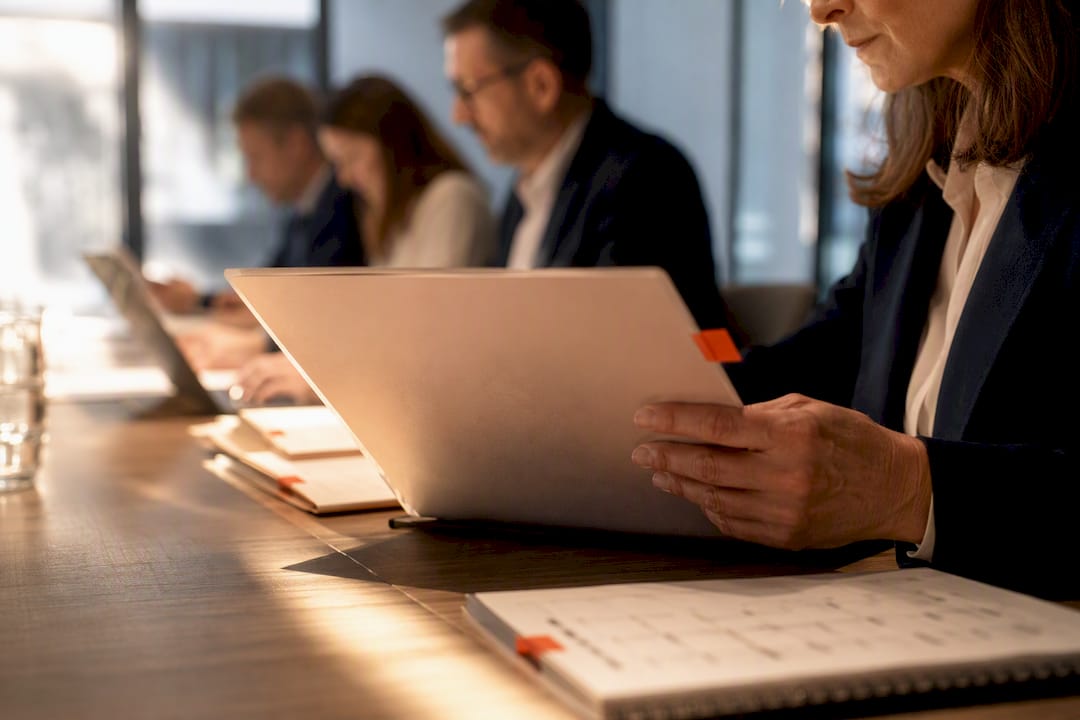 Evaluators comparing vendor proposals and scorecards