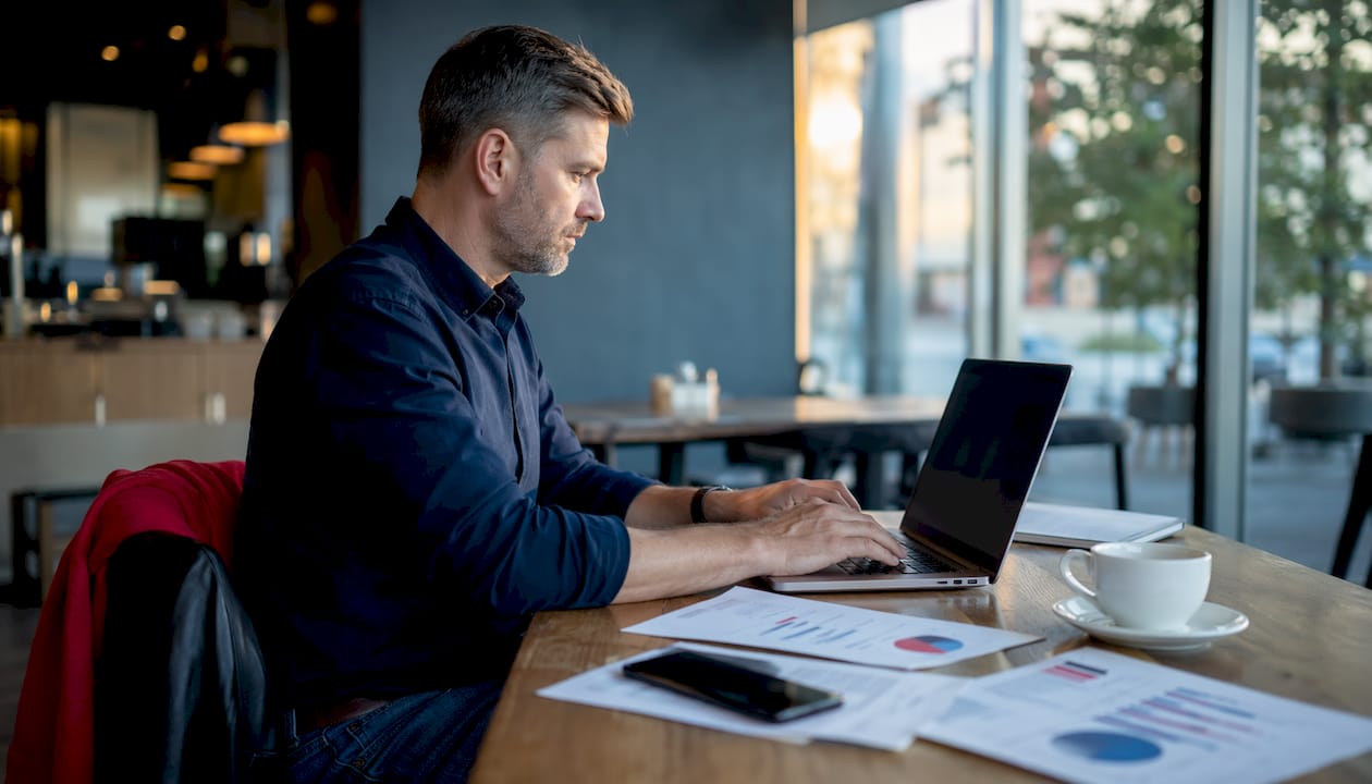 Man working on multichannel marketing workflow