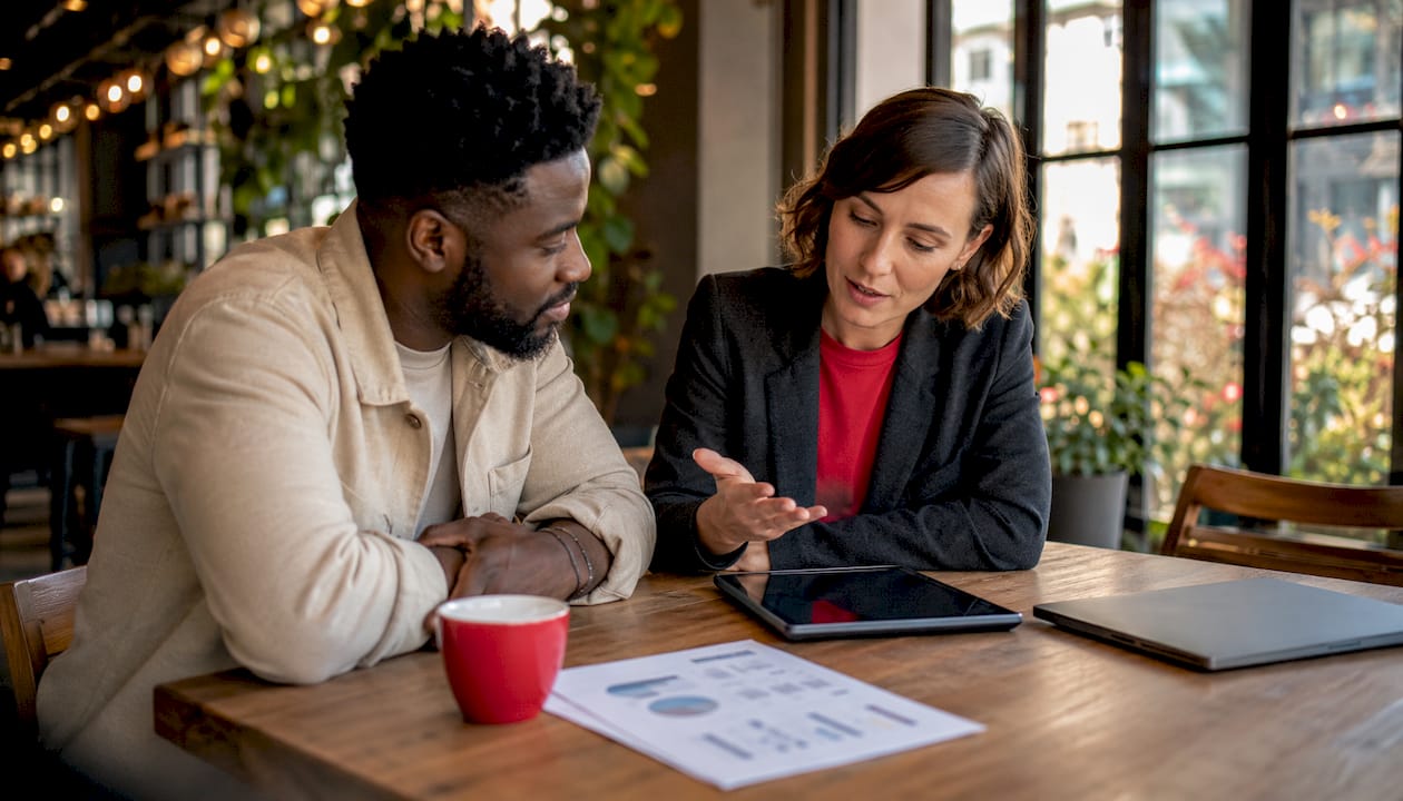Two professionals discussing AI message triggers