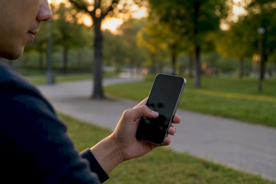 Hand holding phone ready to reply STOP