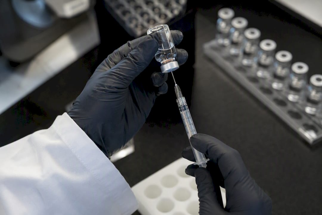 Researcher preparing subcutaneous peptide injection