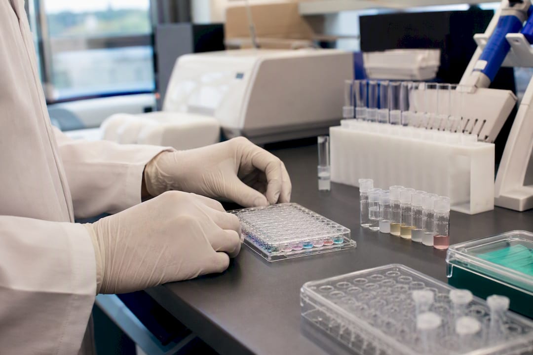 Scientist preparing multi-agonist peptide assay