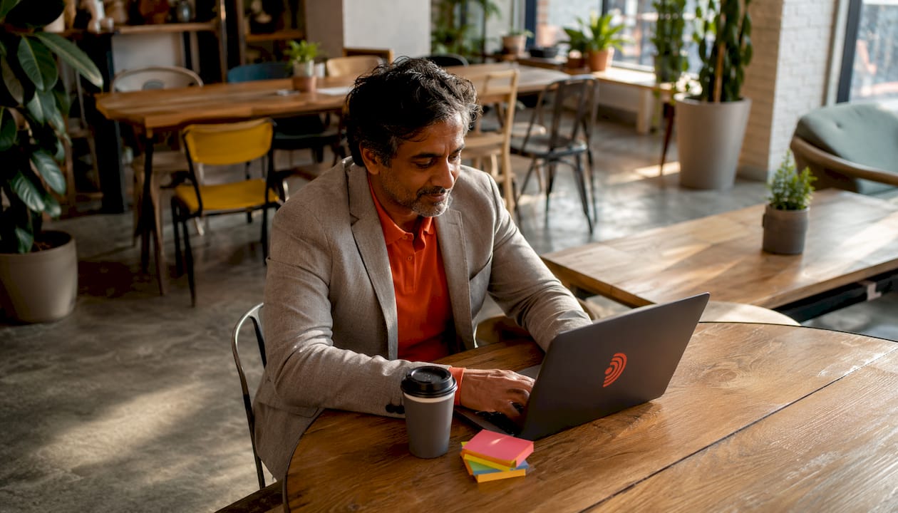 Person working with LinkedIn AI hashtag analysis laptop