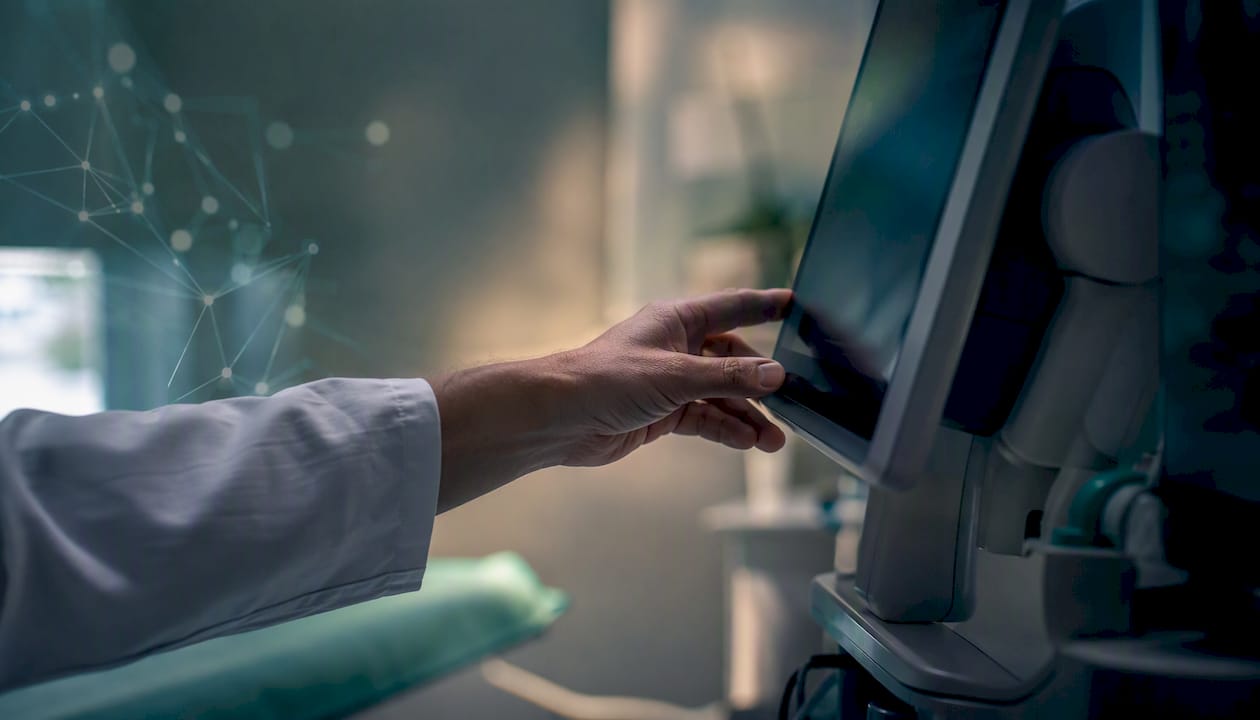 Clinician adjusting diagnostic imaging equipment