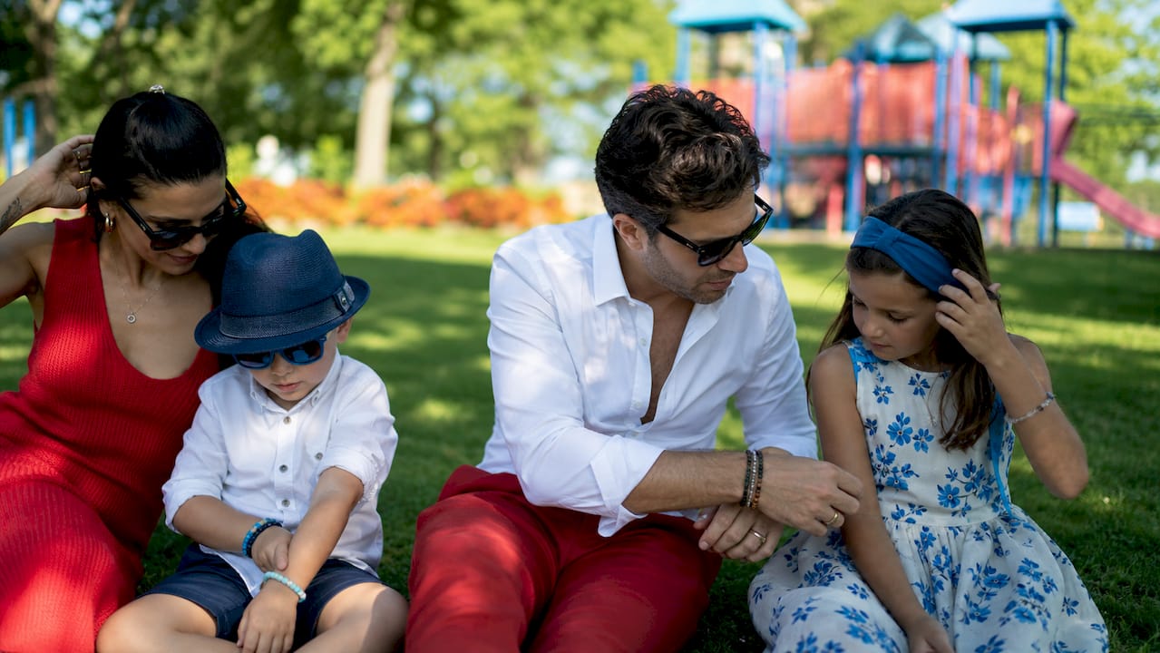 Family in coordinated red, white, and blue parade outfits
