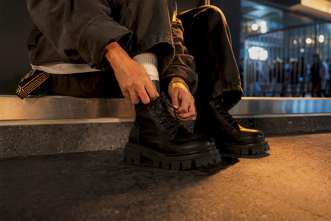 Chunky boots grounding a layered streetwear outfit