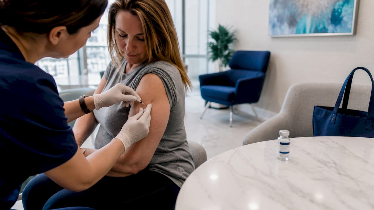 Healthcare worker administering tirzepatide injection