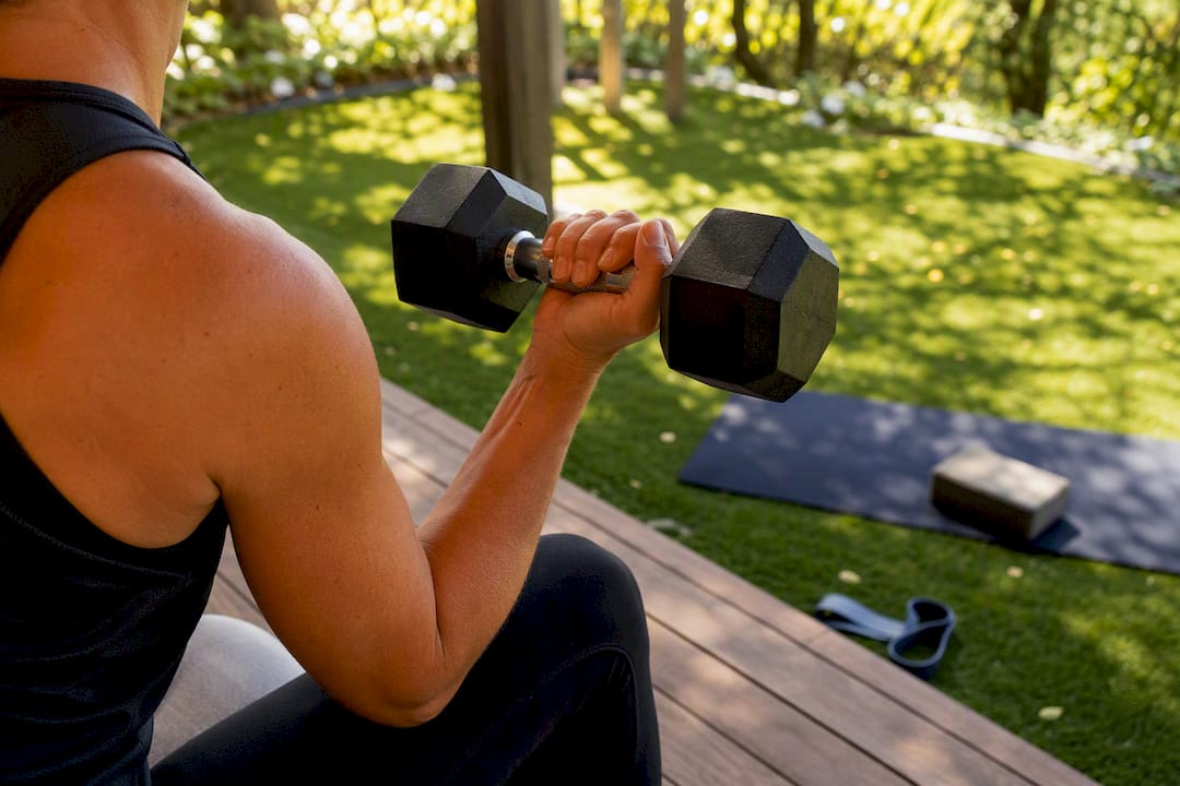 Person lifting dumbbell during resistance training
