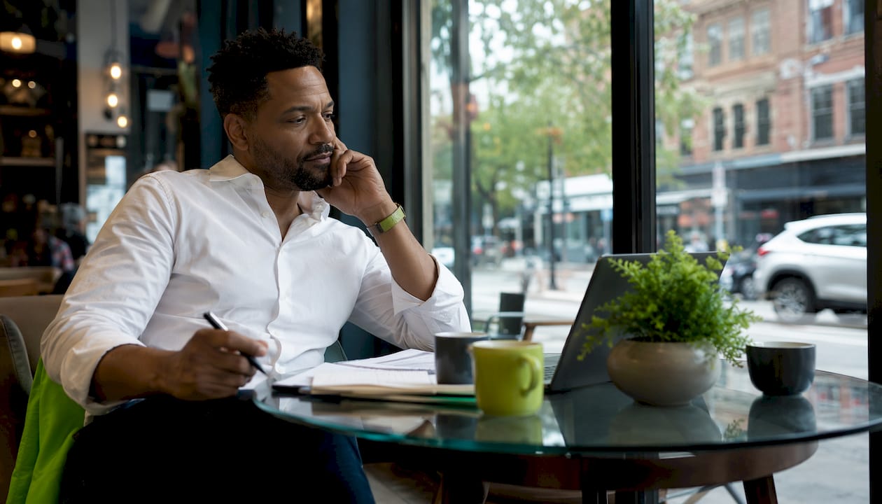 Sports analyst reviewing NBA AI predictions at desk