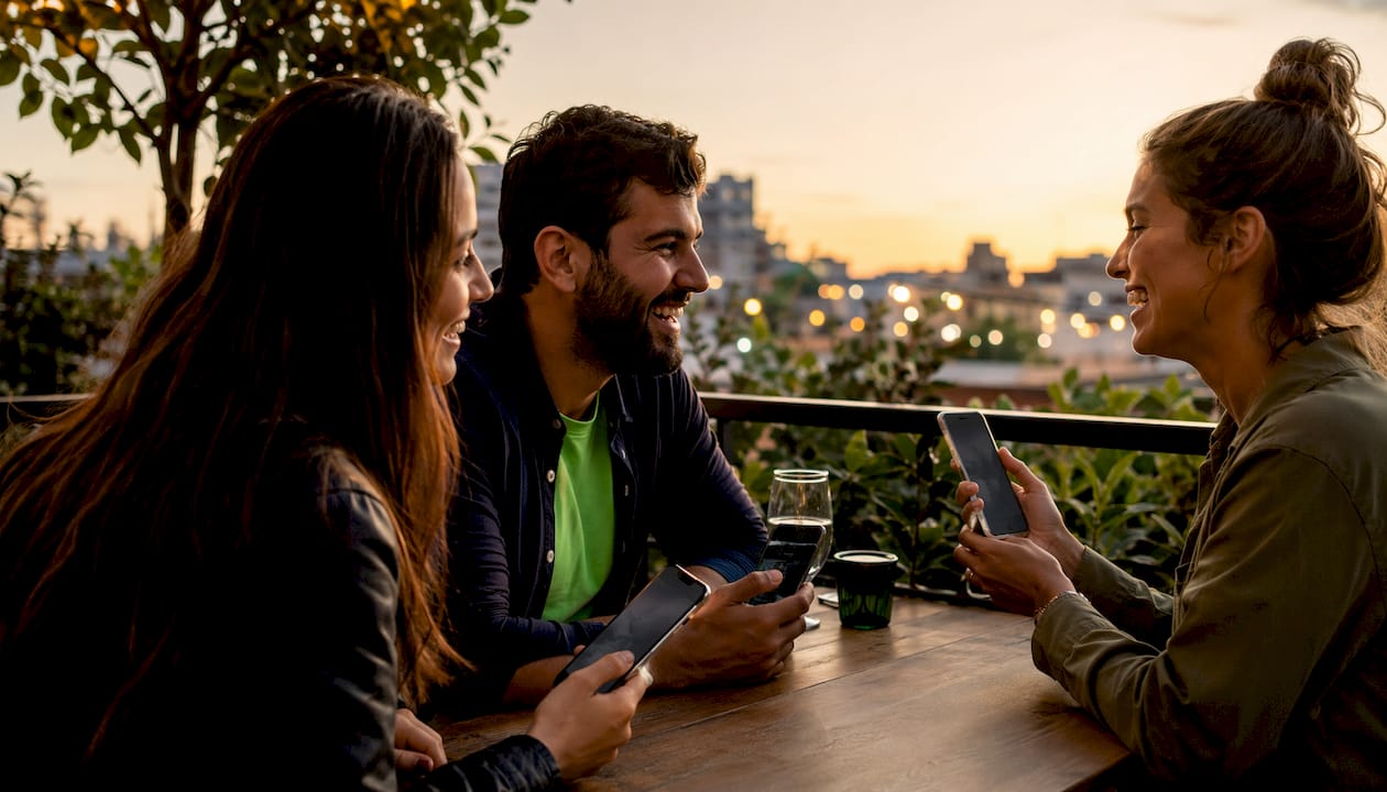Group using mobile sports betting apps together