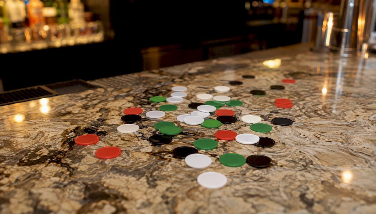 Colored betting tokens stacking stakes
