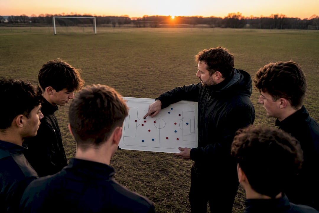 Coach analyzing football xG overperformance board