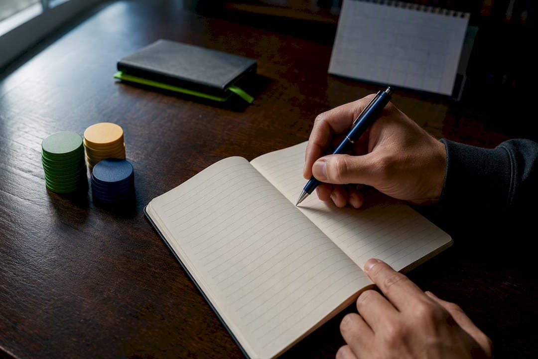 Hand logging a bet in a tracking notebook