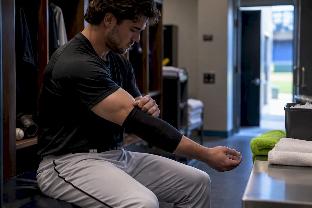 Reliever applying compression sleeve after outing