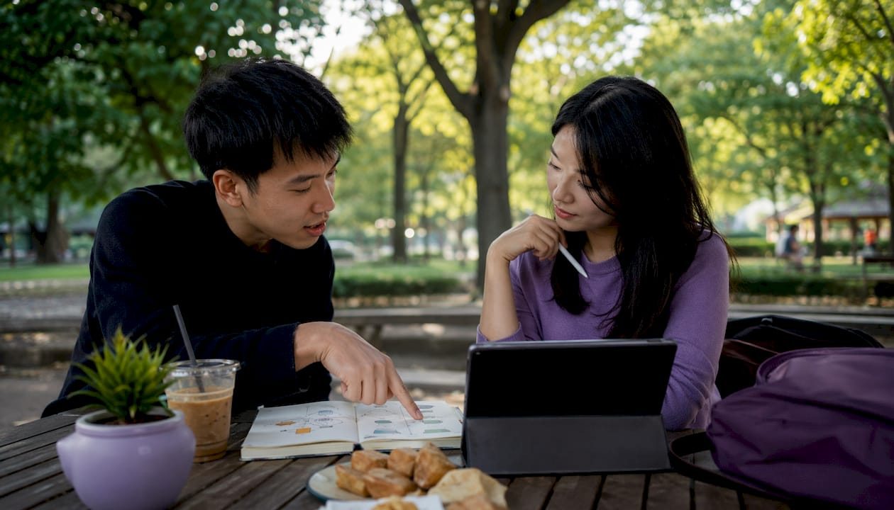 Two writers collaborating in café
