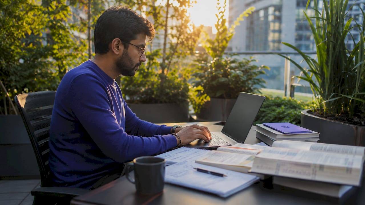 IT admin typing DNS query on laptop in office