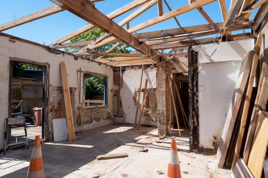Open roof exposing timber framing at renovation site