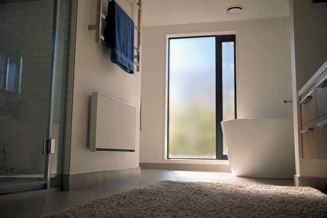 Bathroom heater panel and extractor fan vent