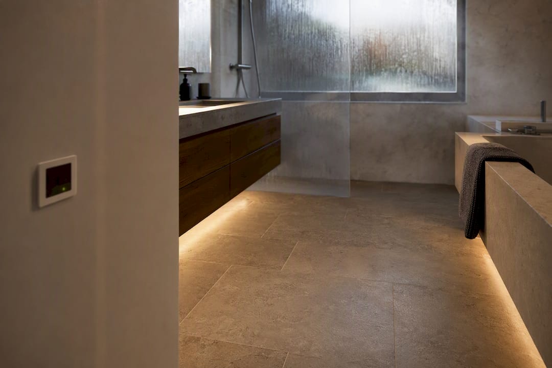 Warm stone bathroom floor with underfloor heating sensor