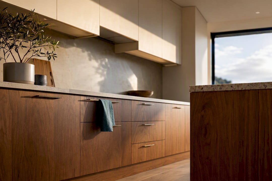 Warm cream and walnut two-tone kitchen cabinetry