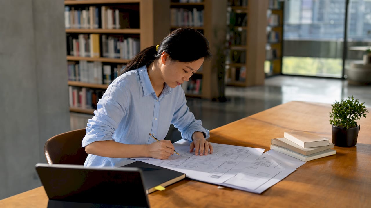 Founder reviewing technical architecture diagrams