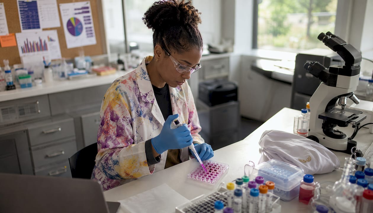 Biomedical researcher preparing cancer therapy samples