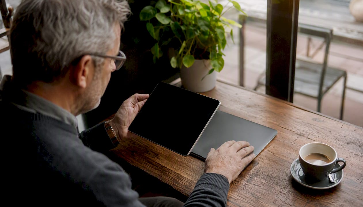 Donor checking charity information at desk