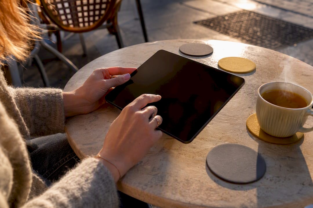 Hand interacting with tablet for donor feedback