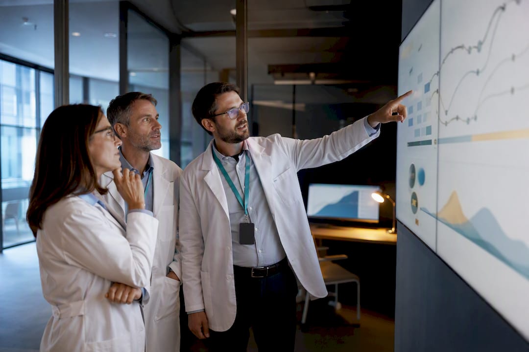 Investigators reviewing adaptive trial data