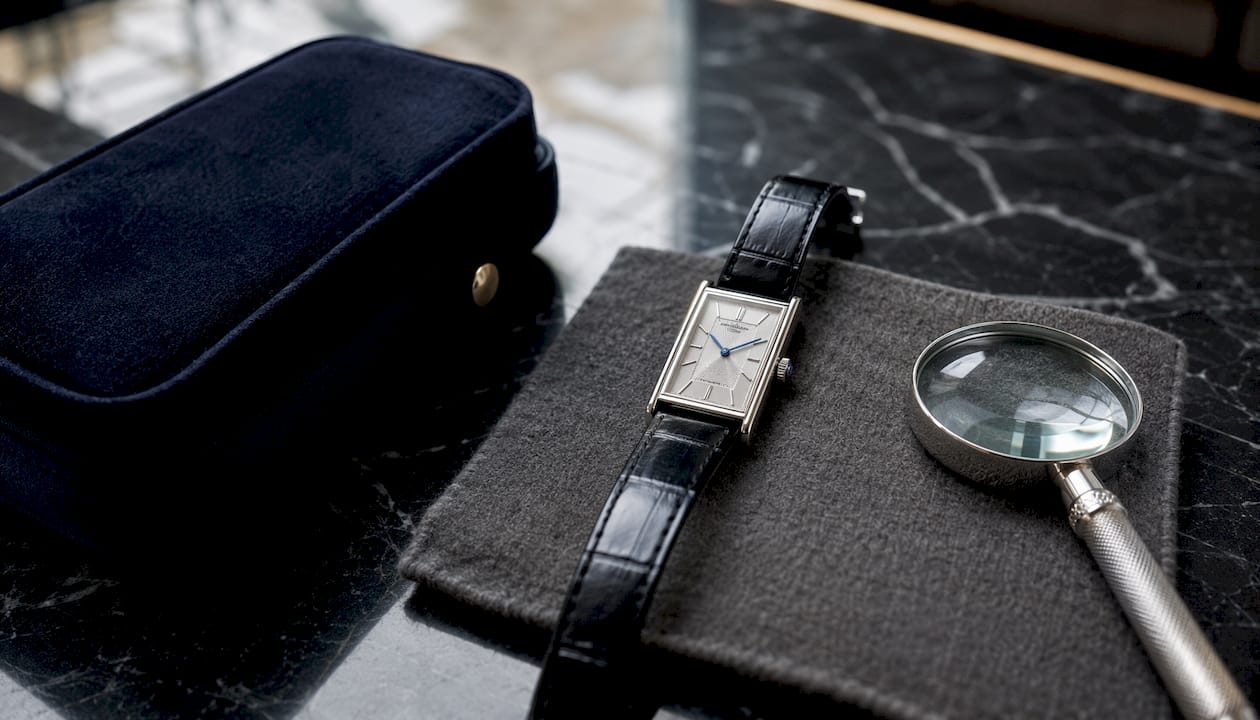 Art Deco minimalist wristwatch on wood table