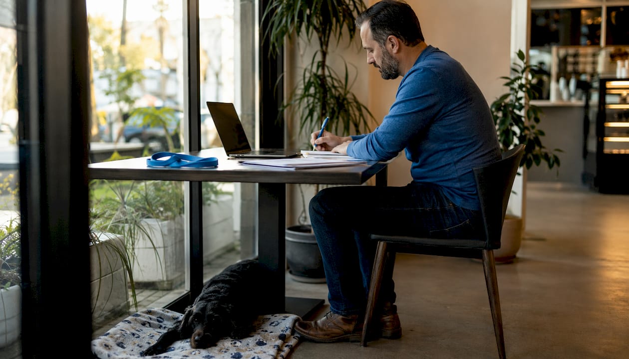 Man completing client intake form for dog walking