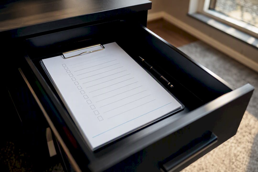 Laminated checklist in drawer at front desk