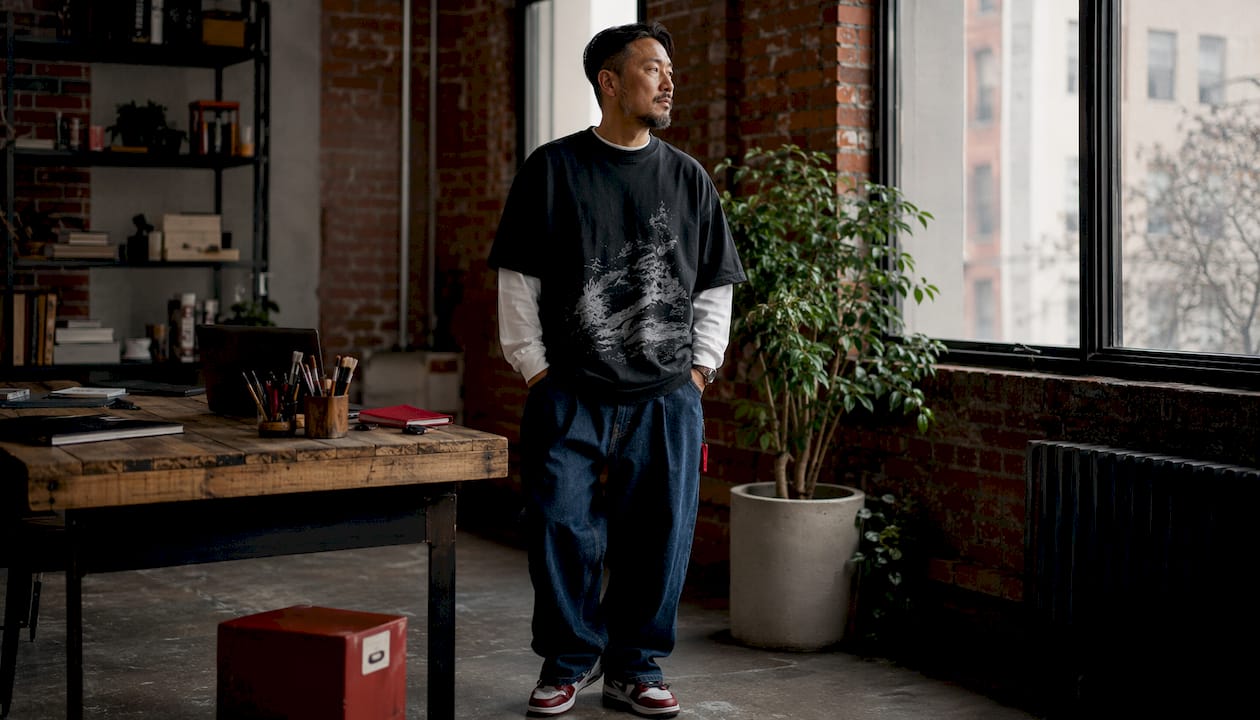 Model in oversized Stüssy streetwear indoors