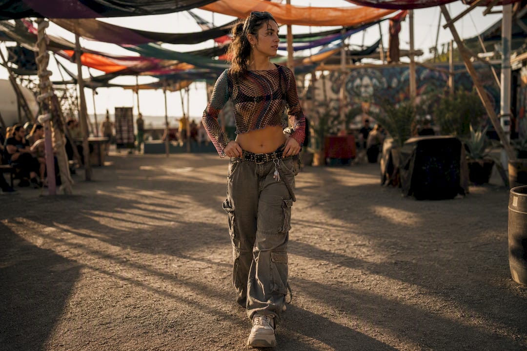 Mesh top and cargo pants outfit detail at festival