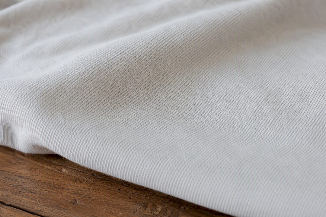 Close-up heavyweight cotton fabric texture of oversized tee