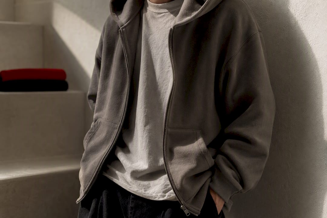 Heavyweight hoodie layered over lighter tonal tee