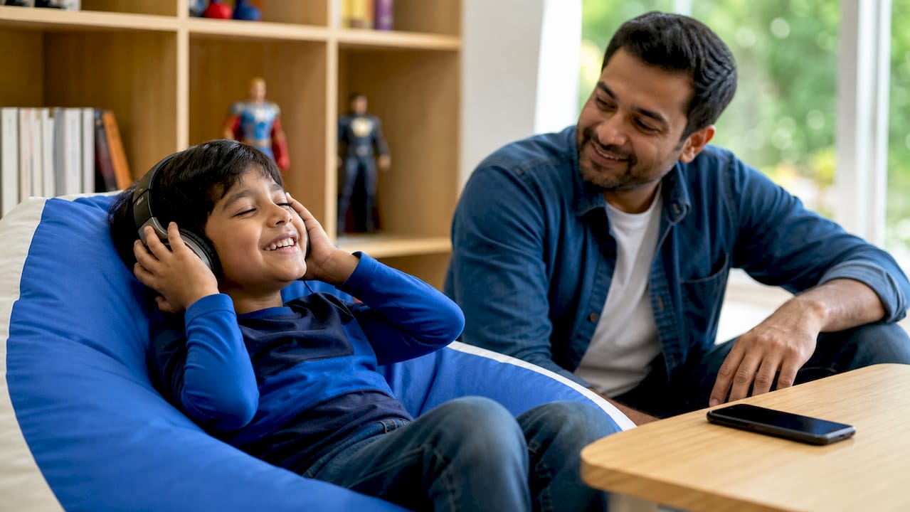 Child enjoying personalized superhero podcast