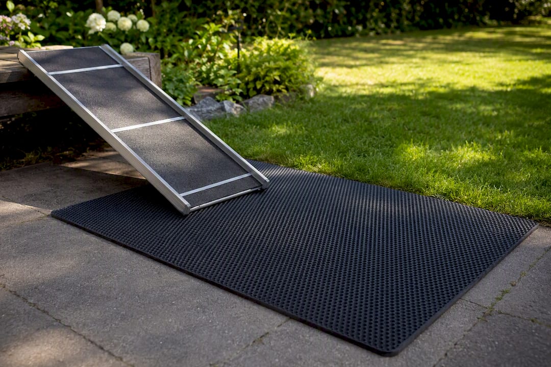 Rubber-backed mat under pet ramp base