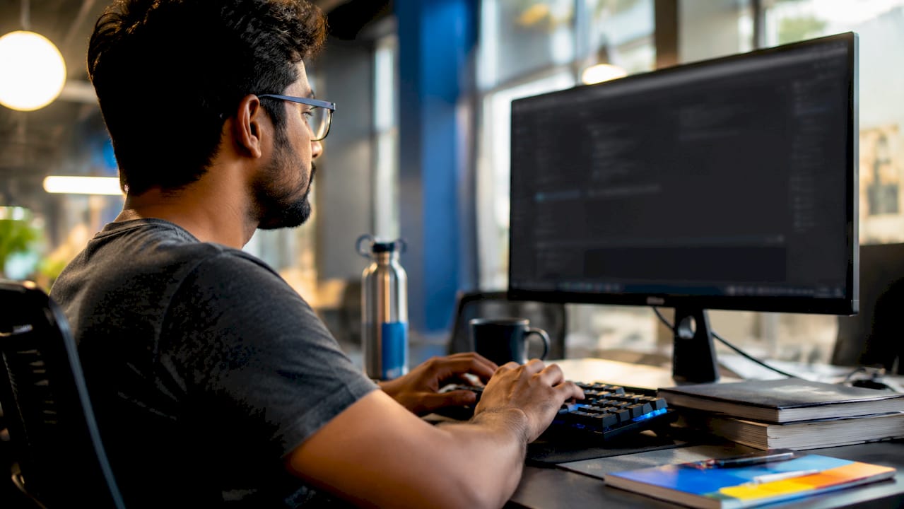 Cybersecurity expert configuring proxy tools at workstation