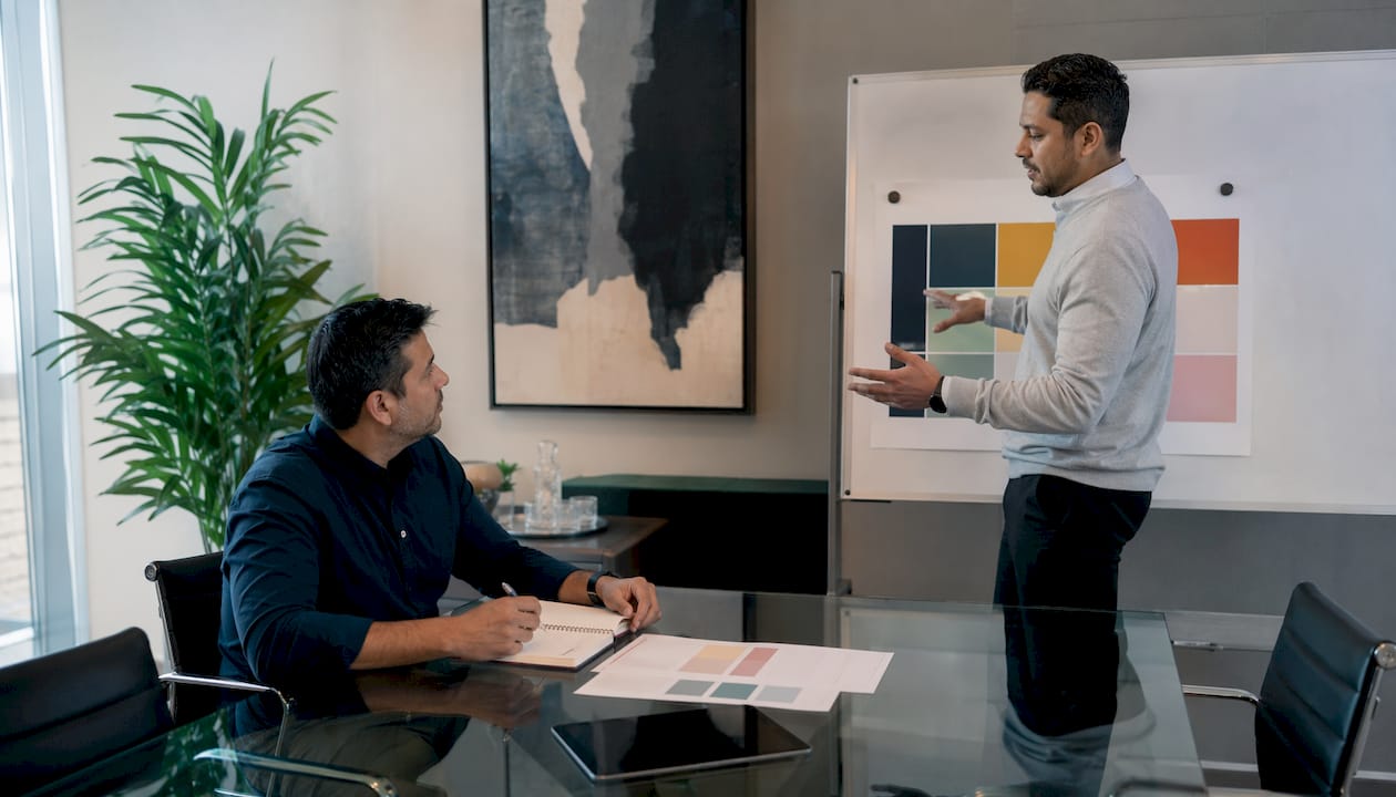 Two professionals discussing AI risk assessment