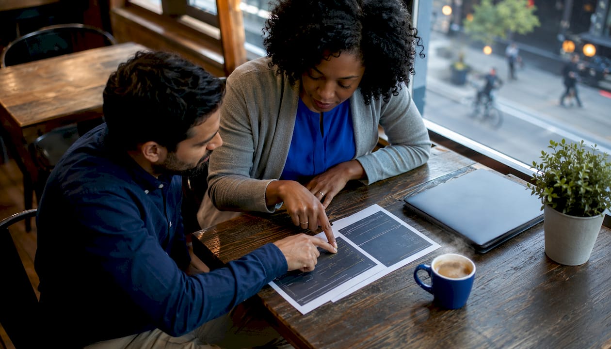 Engineers discussing e-signature integration patterns