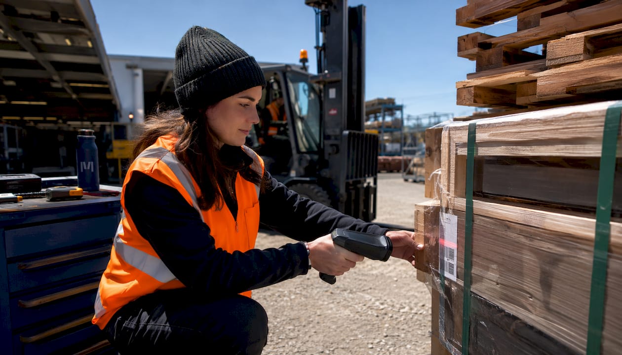 Warehouse worker scanning equipment stock